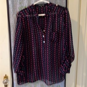 Cute, see through blue and pink blouse with adorable buttons and pocket details